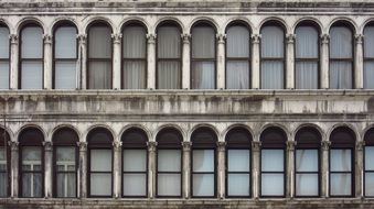 facade of an old historical building with windows in venice