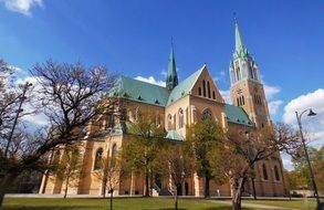 photo of a cathedral with a green roof in Poland