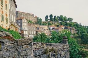 town houses behind a stone wall