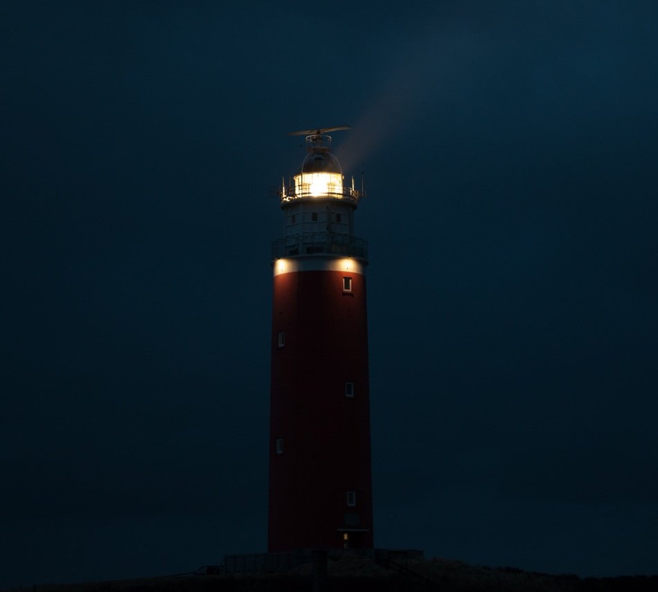 the lights of the lighthouse at night