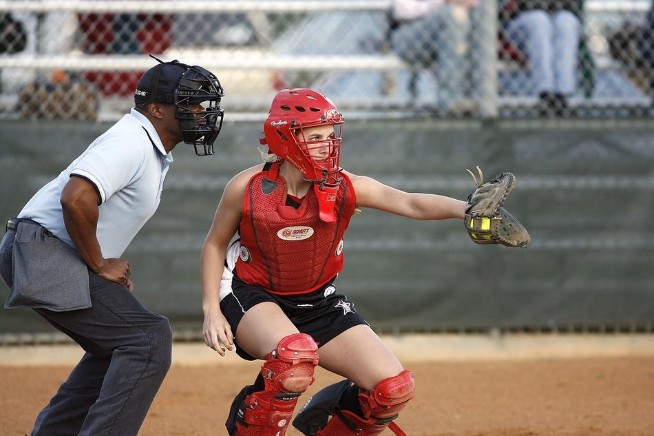 softball catcher in red defense