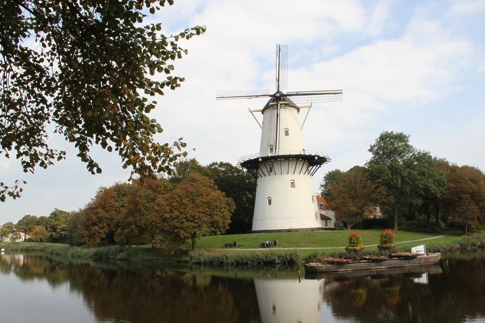 windmill near the river in holland