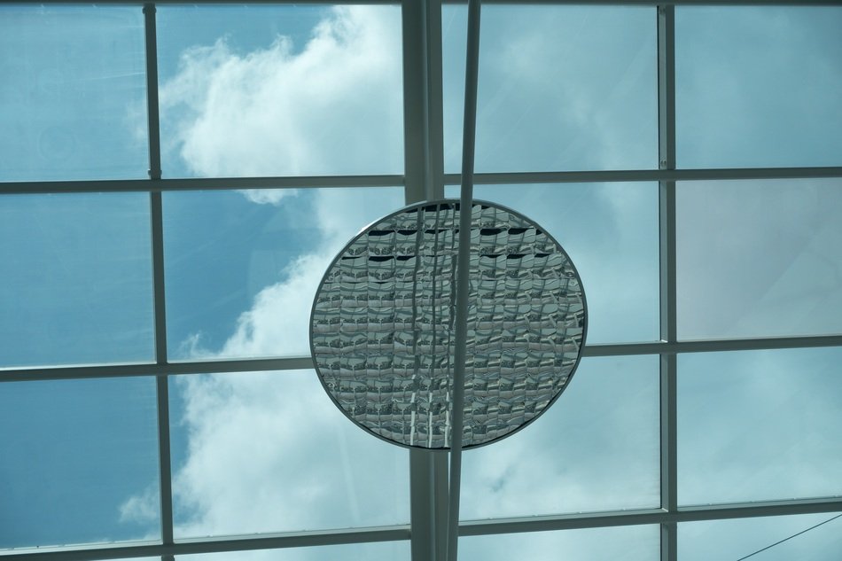 reflector on the glass facade of a modern building