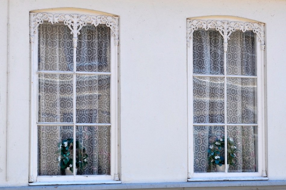 windows of the house on the facade of the old building
