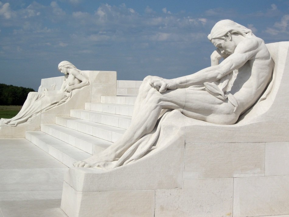 white sculptures on the stairs