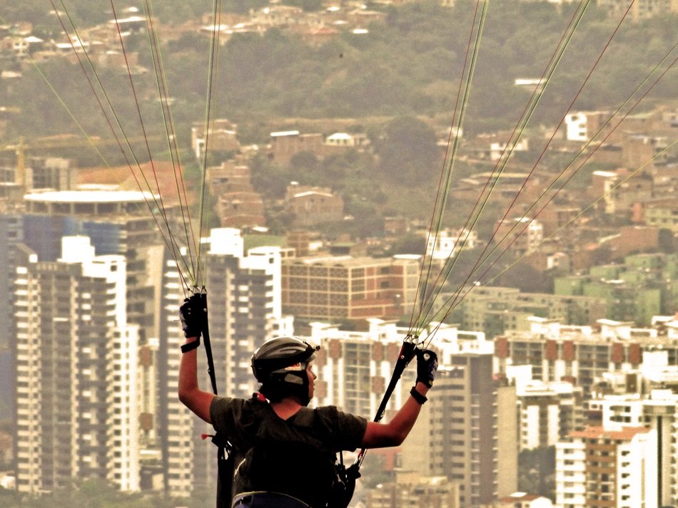 paragliding over the skyscrapers of the city