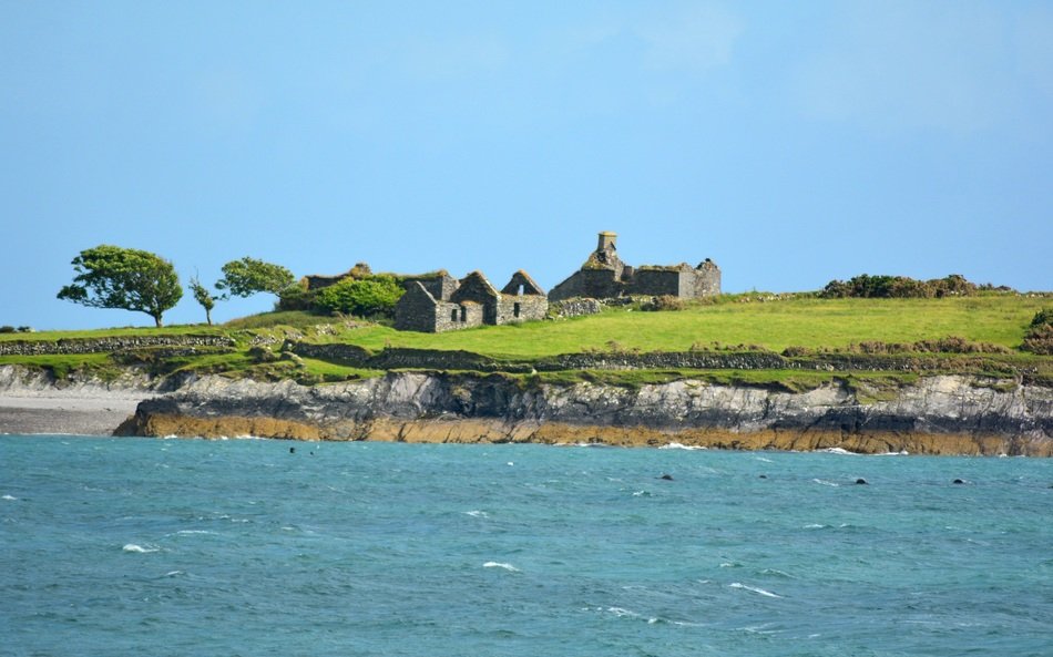 ruins of a building on a green coast