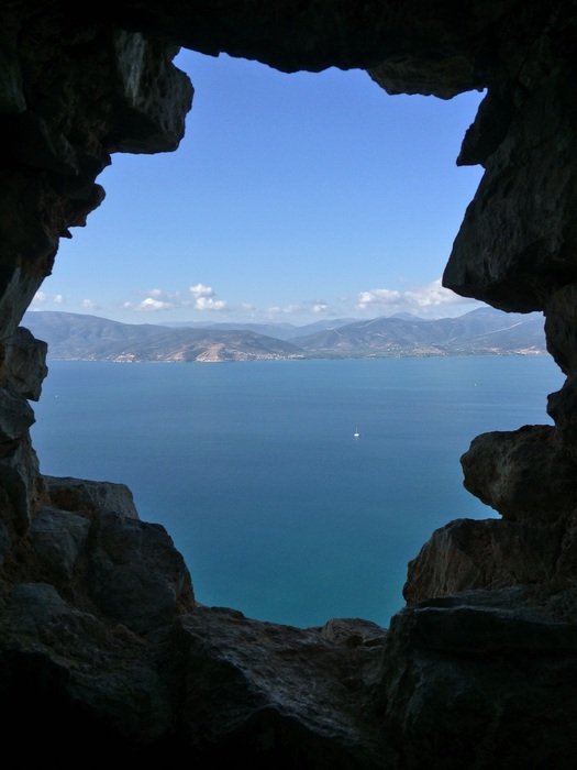 view of the sea through the rock