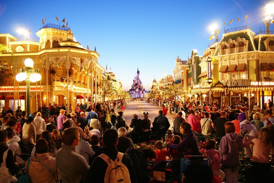 people at disneyland at night