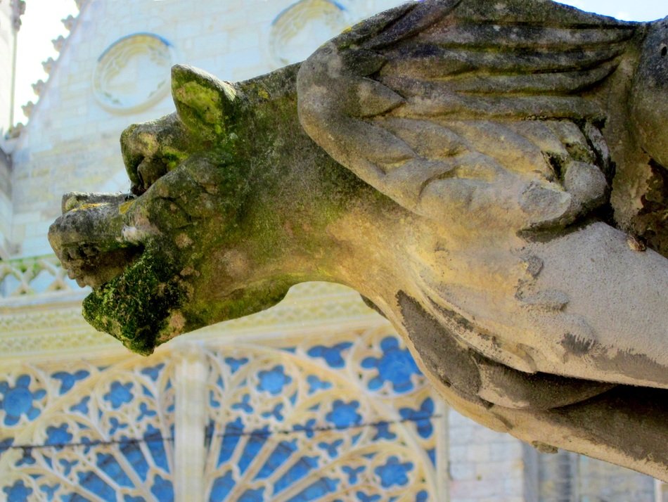 green gargoyle on the building of St. Gatien's Cathedral