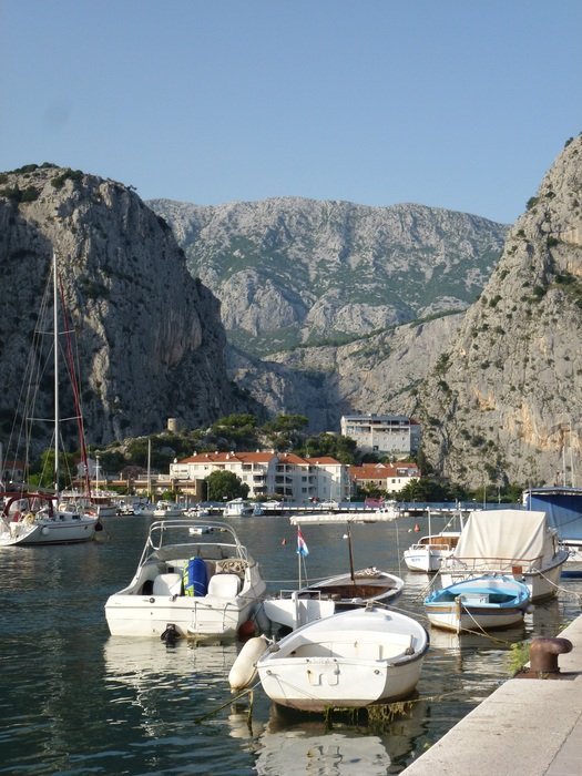 boats on river at scenic Canyon, Croatia, Omiś