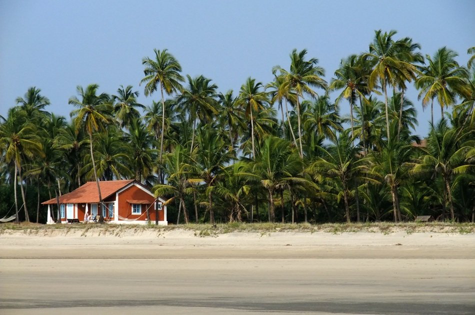 House on the beach with the palms