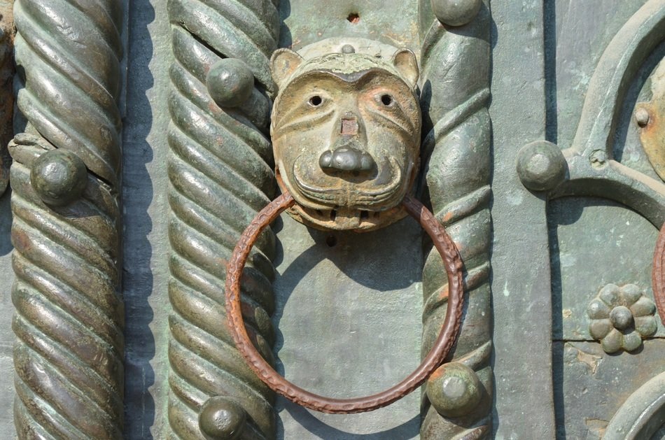 closeup photo of medieval door knob on the door