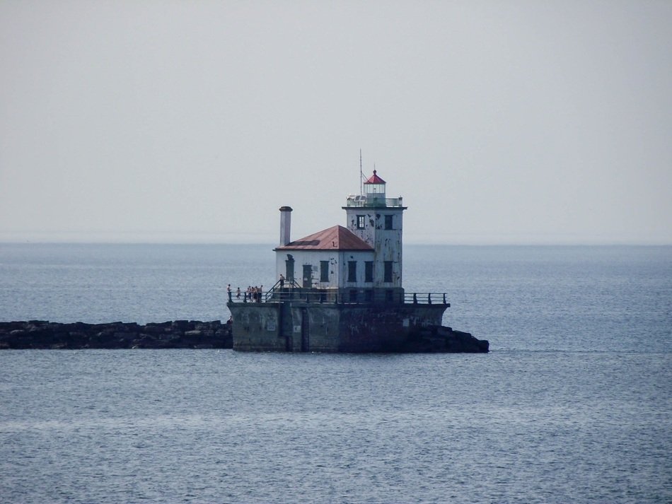 lighthouse in the water in the ocean