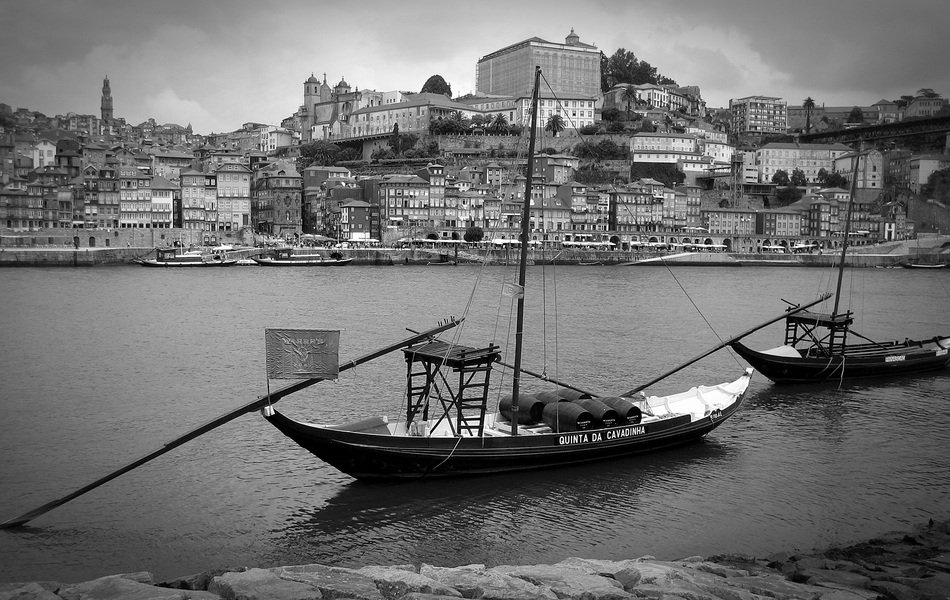 black and white photo of boats in port in portugal