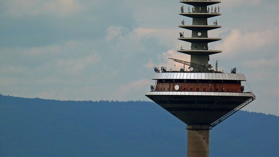 restaurant in a television tower with the mountains on background