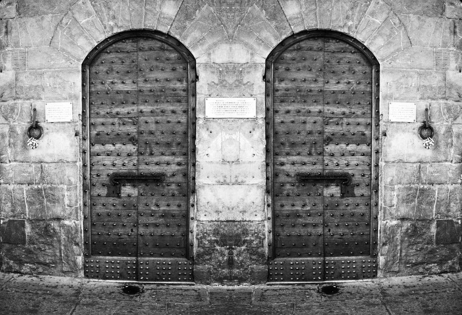 black and white photo of the door to the building