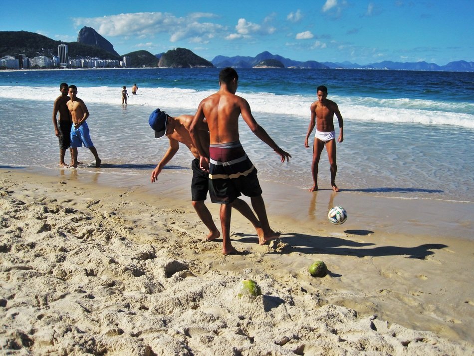 Brazilians play soccer on the beach
