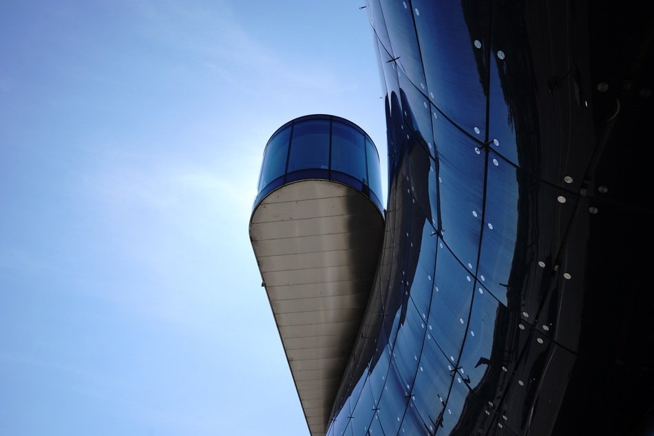 glass facade of the building against the sky