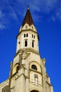 Wallfahrtskirche La Visitation building at blue sky background with white clouds