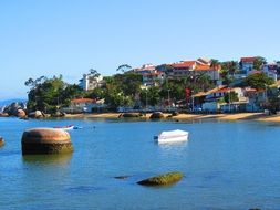 colorful villas on tropical coast at sea