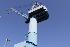 blue metal crane in a shipyard