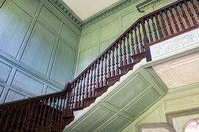 staircase with wooden railing in the mansion