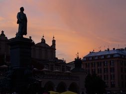 monument in front of the Cloth Hall in Krakow