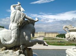 white statues in the fountain in front of the palace in Vienna