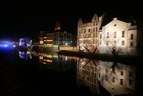 houses on the embankment in opole at night