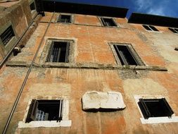 dilapidated facade of an old building in rome