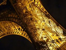 eiffel tower in golden night illumination
