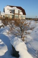 beautiful house among the winter landscape