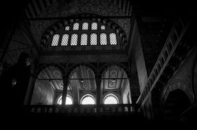 black and white photo of a building with arched windows