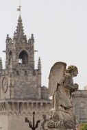 statue of a angel near a cathedral in france