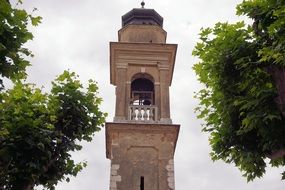 Tower Stone Building among the green trees