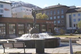 freedom monument on square, life out of chaos, norway, narvik
