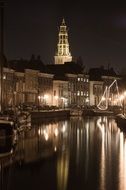 Church mirroring on Canal at Night, netherlands, Groningen