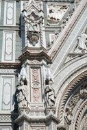 column with sculptures on a building in Italy