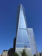 Glass world trade center skyscraper at blue sky background in NY