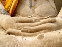hands of a statue close up