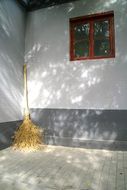 broom in the corner of the house