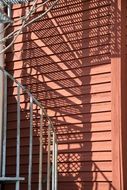 spiral staircase near the wall in the play of light and shadow