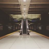 escalator in the hall at the metro station