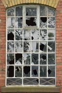 Old broken Window in brick wall