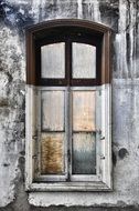 half painted window on grunge facade