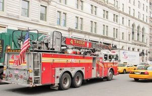 fire truck and cars on a busy street in new york