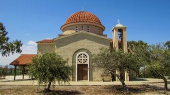 Beautiful brick orthodox among the plants church in cyprus
