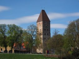 green trees near the tower near the Danube river