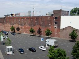 parking lot near the brick building